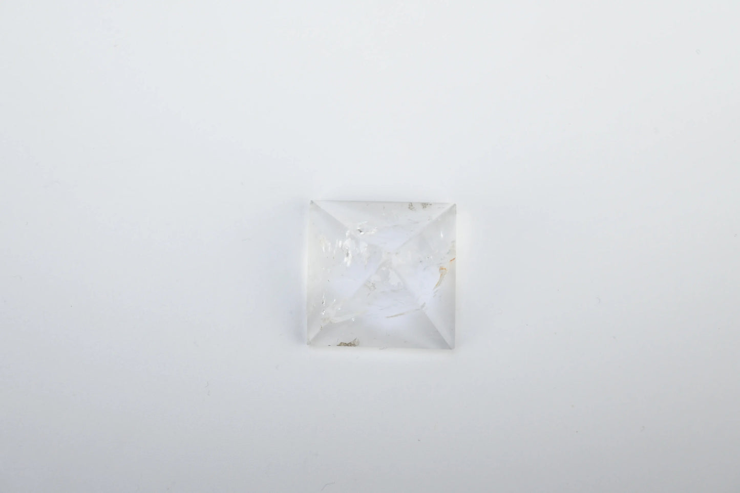 Vrishta Small Clear Quartz Pyramid displayed on white background
