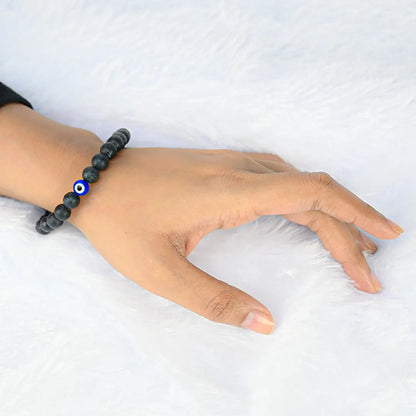 Woman wearing Vrishta Natural Evil Eye Bracelet on wrist for style and protection