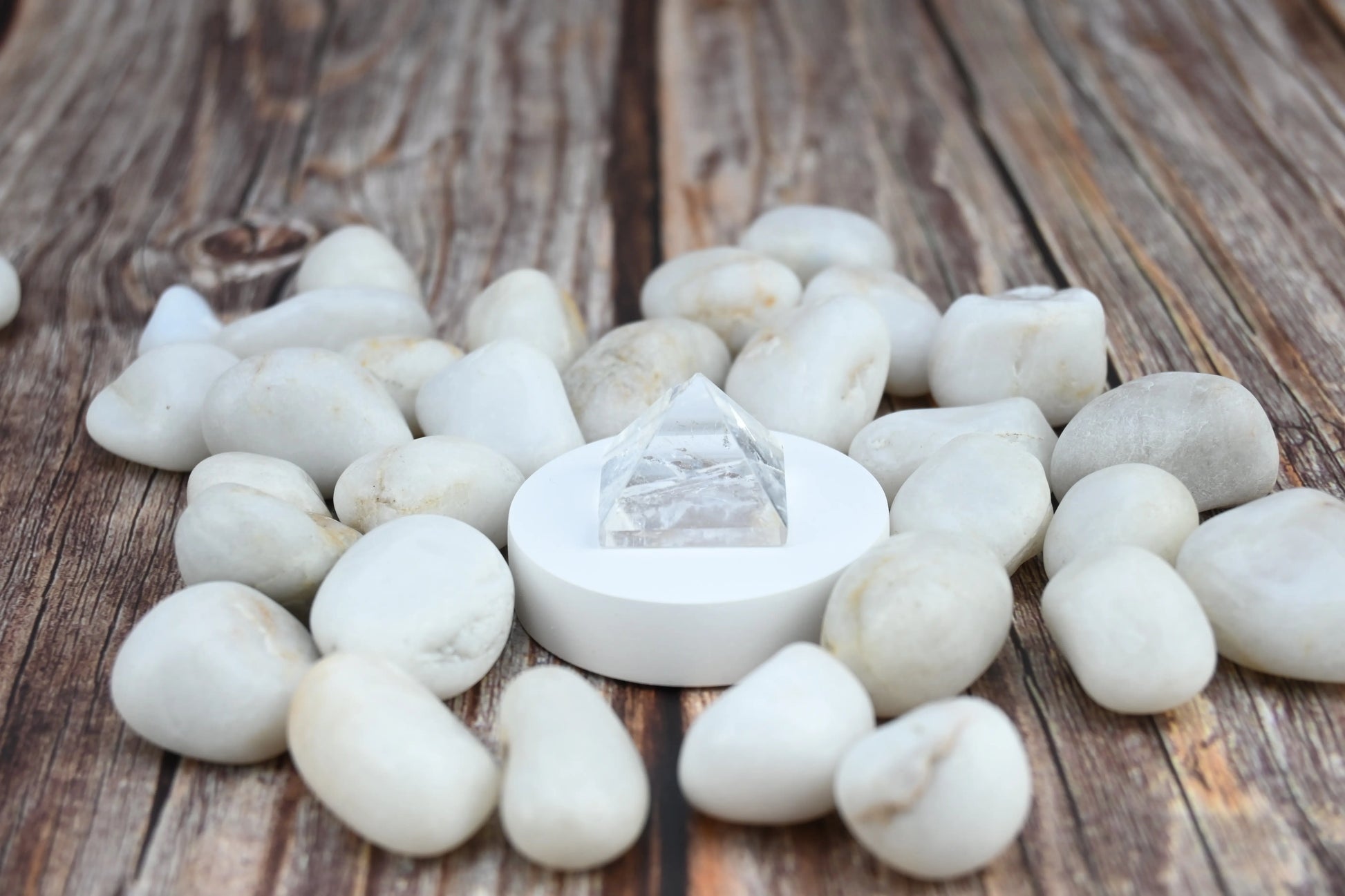 Showcasing Vrishta Small Clear Quartz Pyramid in product display