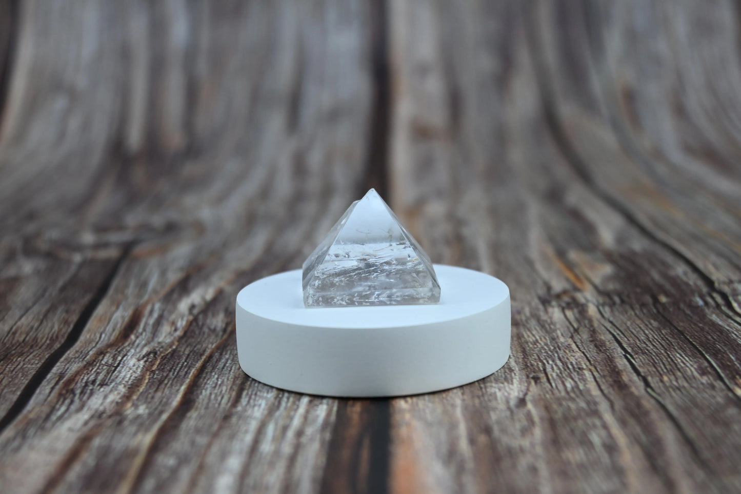 Side view of Vrishta Small Clear Quartz Pyramid showing polished finish