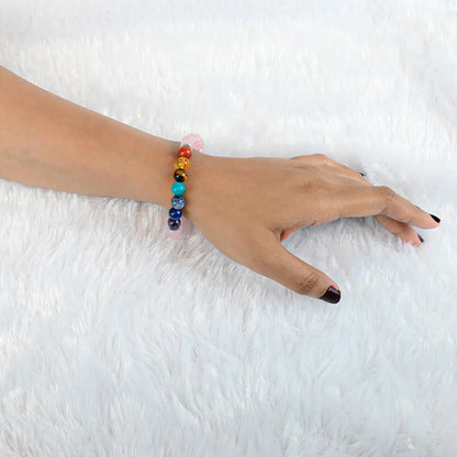 Woman wearing Vrishta 7 Chakra Rose Quartz Bracelet on wrist