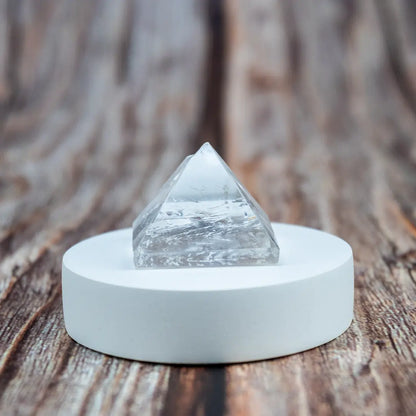 Close-up of Vrishta Small Clear Quartz Stone Pyramid highlighting natural crystal clarity