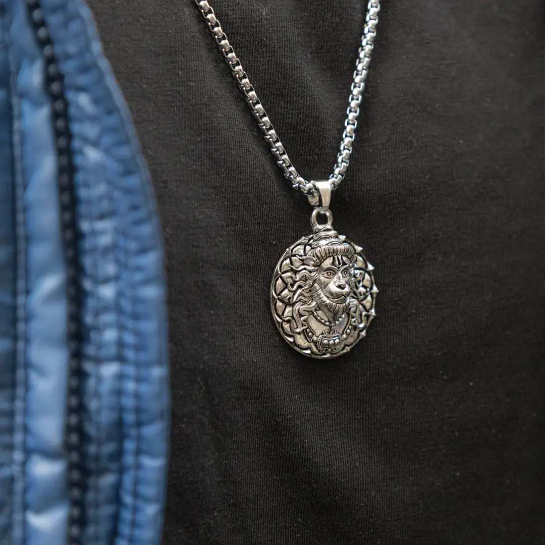 Man wearing Vrishta Veer Hanuman Sterling Silver Coated Chain Pendant for strength and devotion